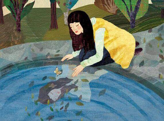 Kvinna i en vattenspegel