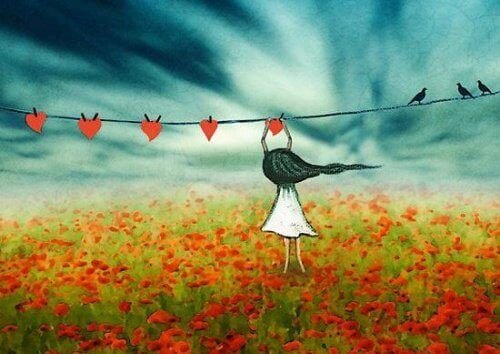 flicka hänger hjärtan på tork