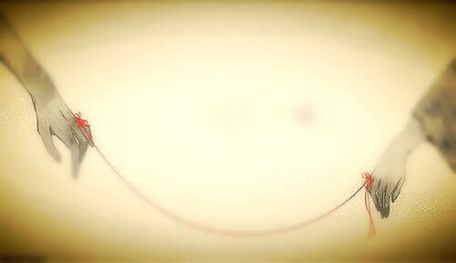 Röd tråd som symboliserar distansförhållanden