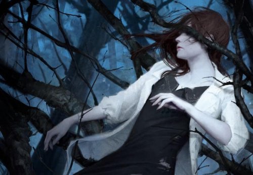 kvinna i taggig buske