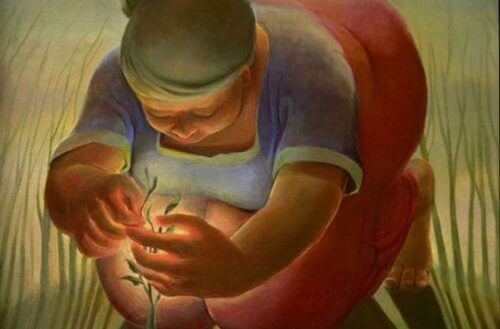 Kvinna sköter om liten växt