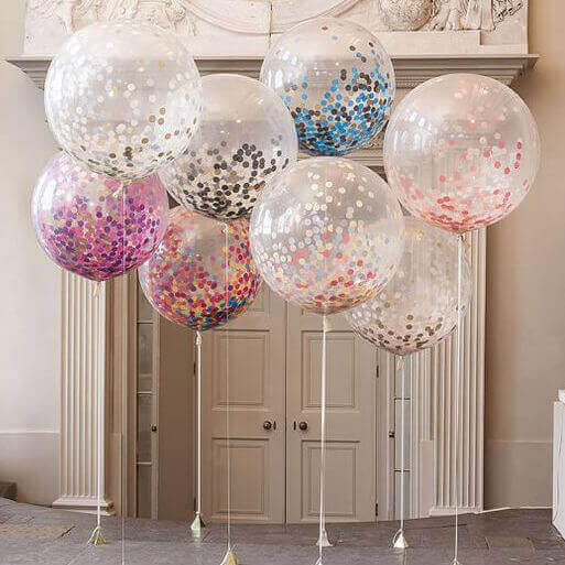 Genomskinliga ballonger med konfetti.