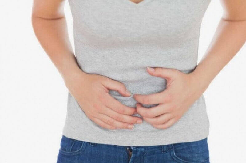 person som har ont i magen
